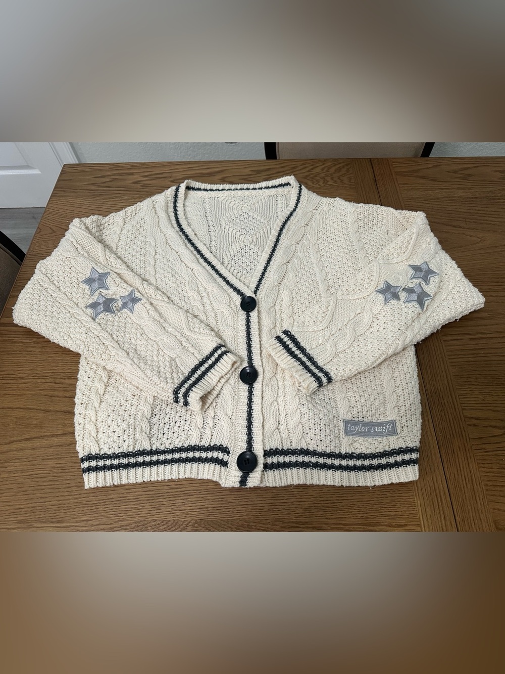Taylor Swift Cream Cable Cardigan with Navy Trim and Star Patches very oversized